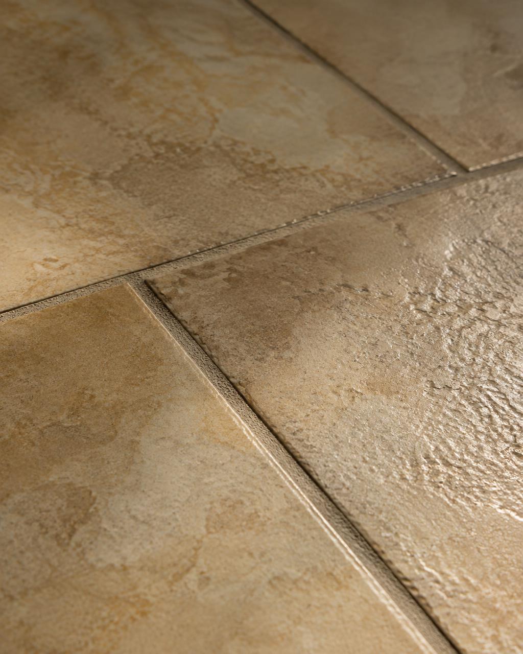 Close-up of stone tile and grout lines in raking light (illustrative image)