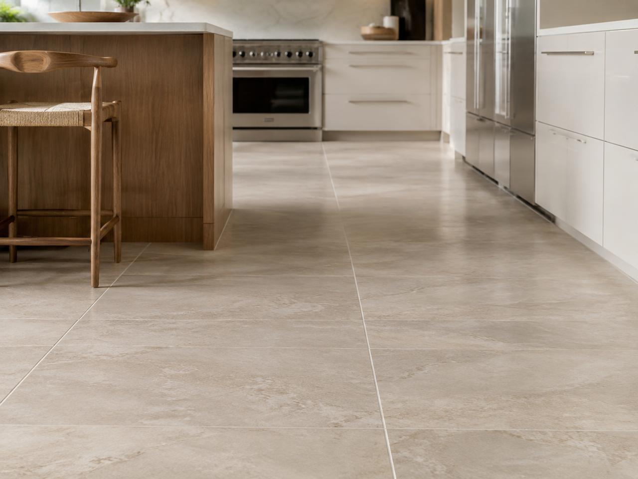 Stone-look tile floor with clean grout lines in a bright kitchen (illustrative image)